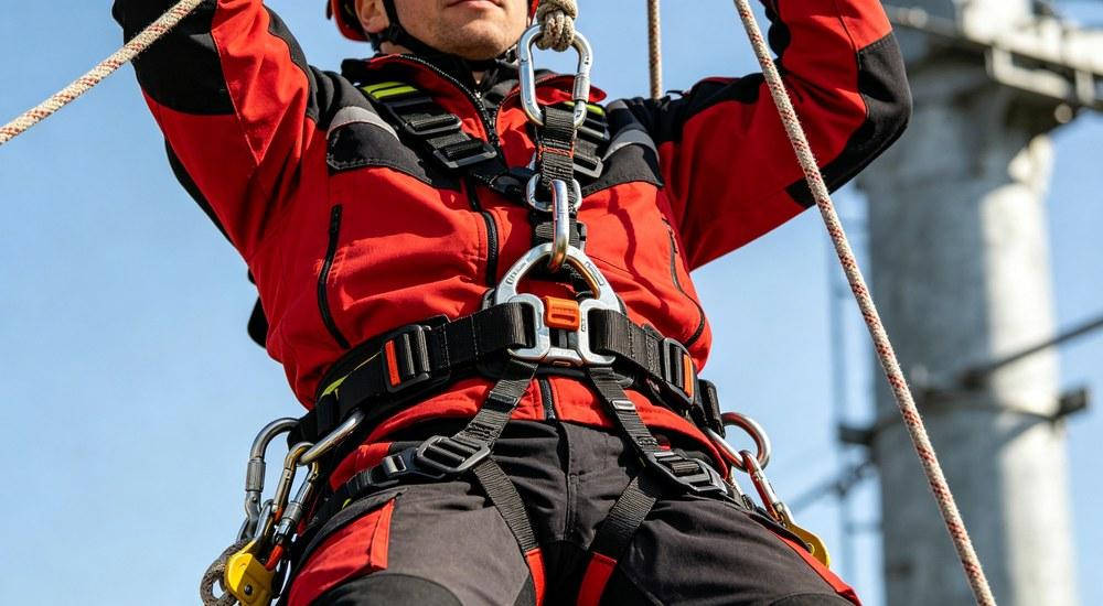 Rescue worker using full body harness for vertical rope rescue operation Rescue worker using full body harness for vertical rope rescue operation