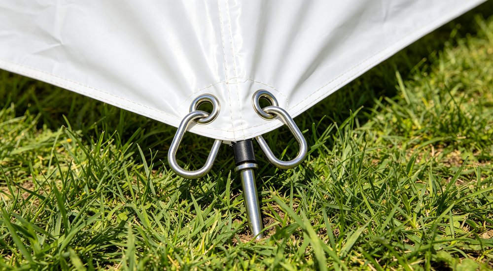 Fixing rings and anchoring points on inflatable medical tent, close-up detail of D-rings red and white inflatable emergency shelter for disaster relief operations