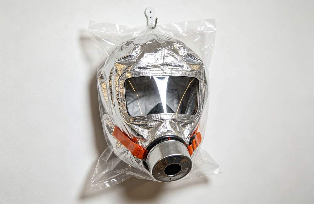 Sealed silver EN403 smoke mask in individual plastic packaging ready for bulk wholesale home fire kit and emergency supply orders today Sealed silver EN403 smoke mask in individual plastic packaging ready for bulk wholesale home fire kit and emergency supply orders today