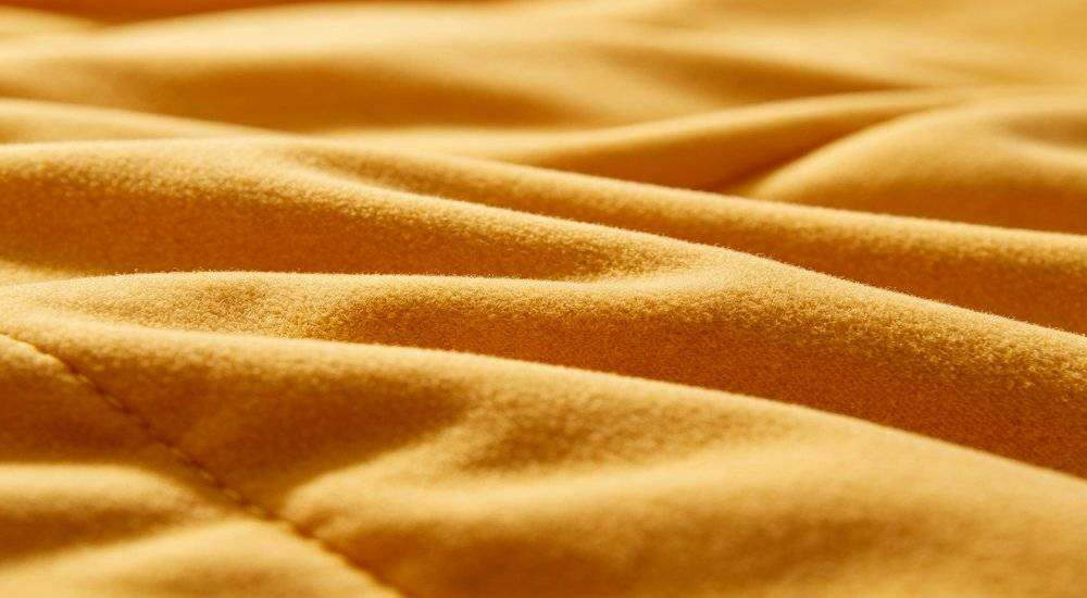 Close up of soft sleeping bag inner lining fabric skin-friendly comfortable material texture macro