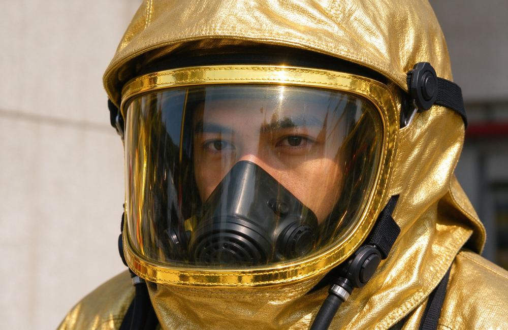 Side view of fire entry suit gold visor detail showing reflective face shield for extreme heat protection and visibility during fire entry operations